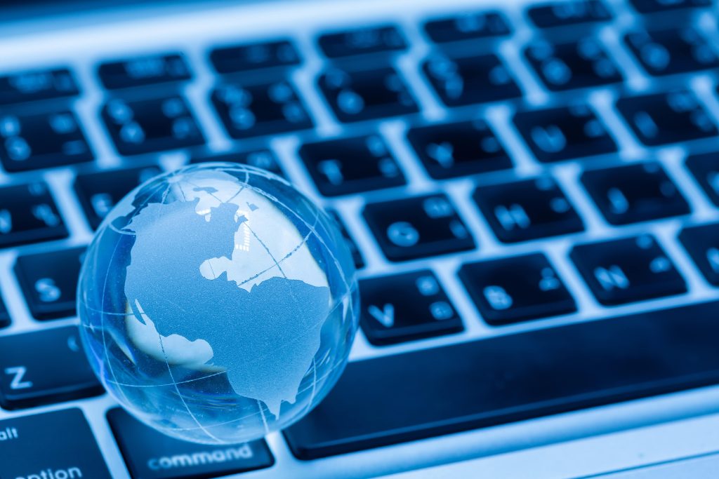 Globe on keyboard, symbolising the internationalisation of technical documentation