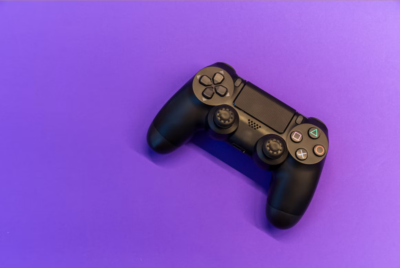 Game controller on purple background